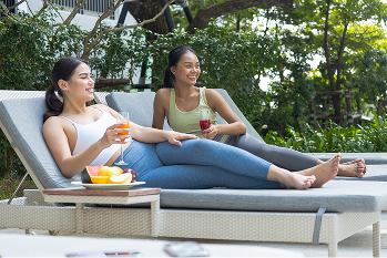 Young female friends drink fruit juices such as ap utc